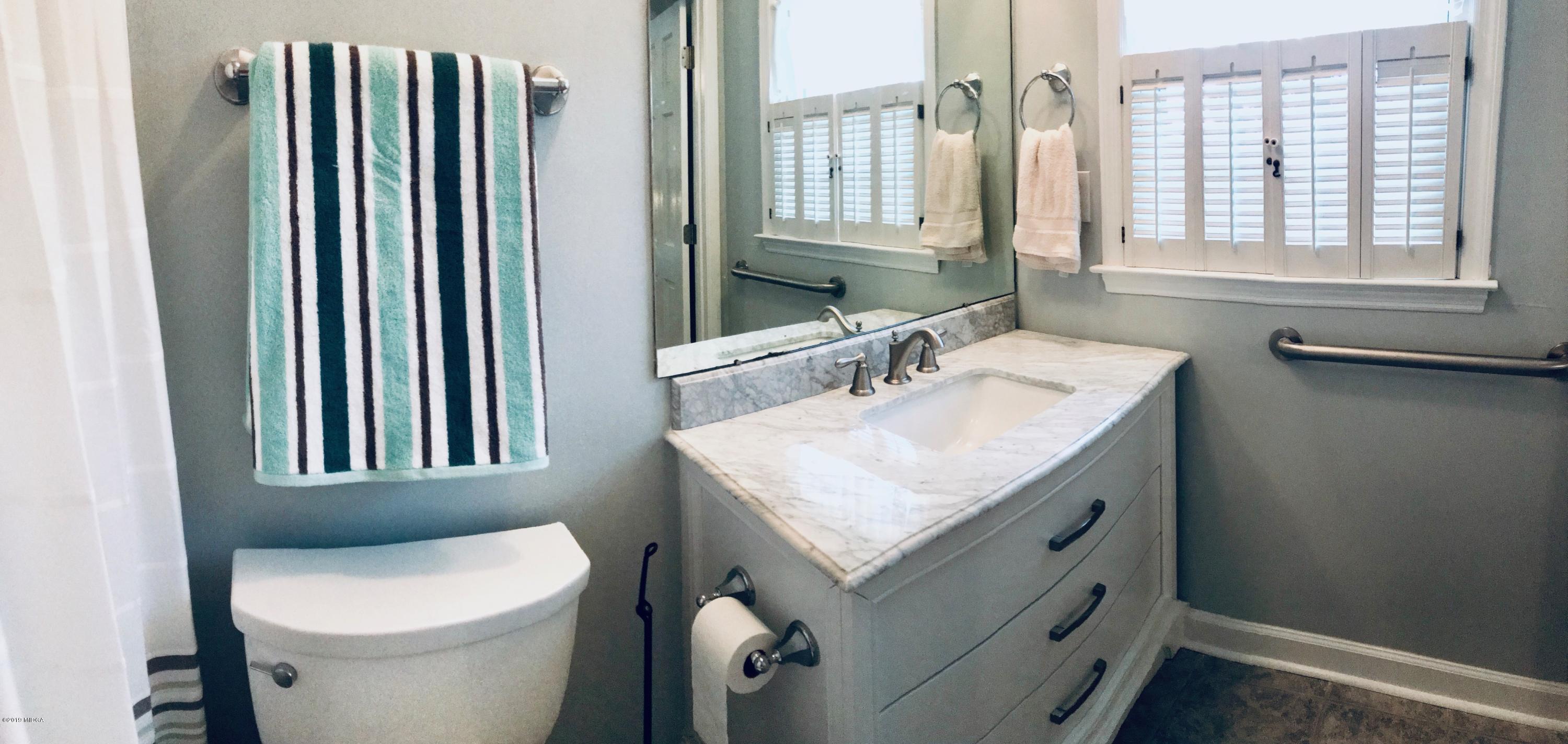 5838 School Road Macon, GA 31216 - Photo 31 of 33 a bathroom with a sink toilet and mirror