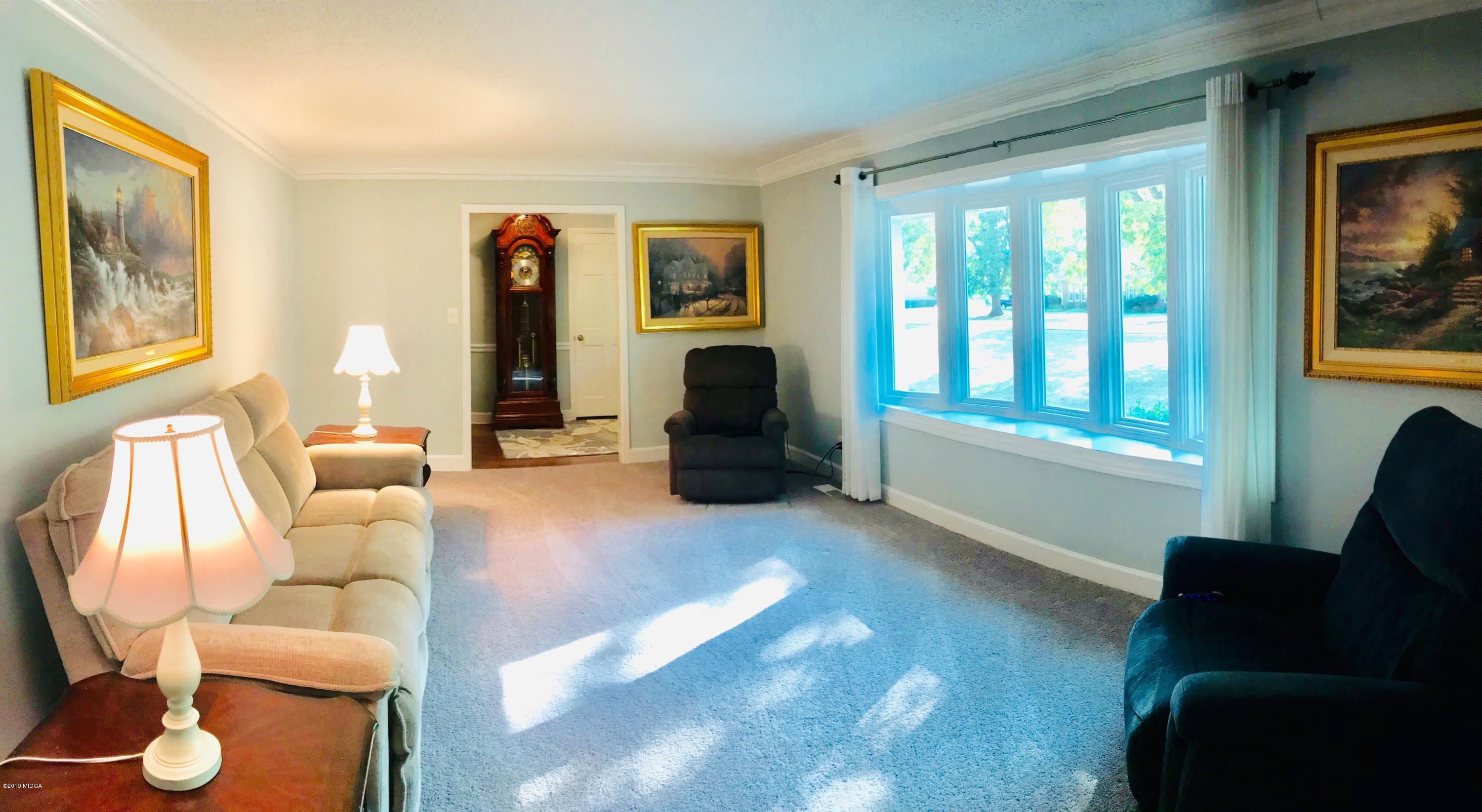 5838 School Road Macon, GA 31216 - Photo 5 of 33 a living room with furniture and large windows