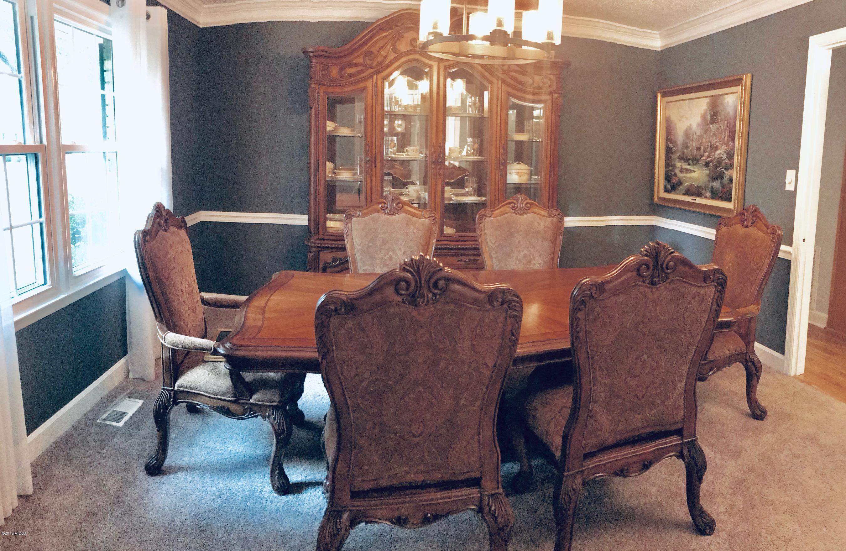 5838 School Road Macon, GA 31216 - Photo 8 of 33 a view of a dining room with furniture and a window