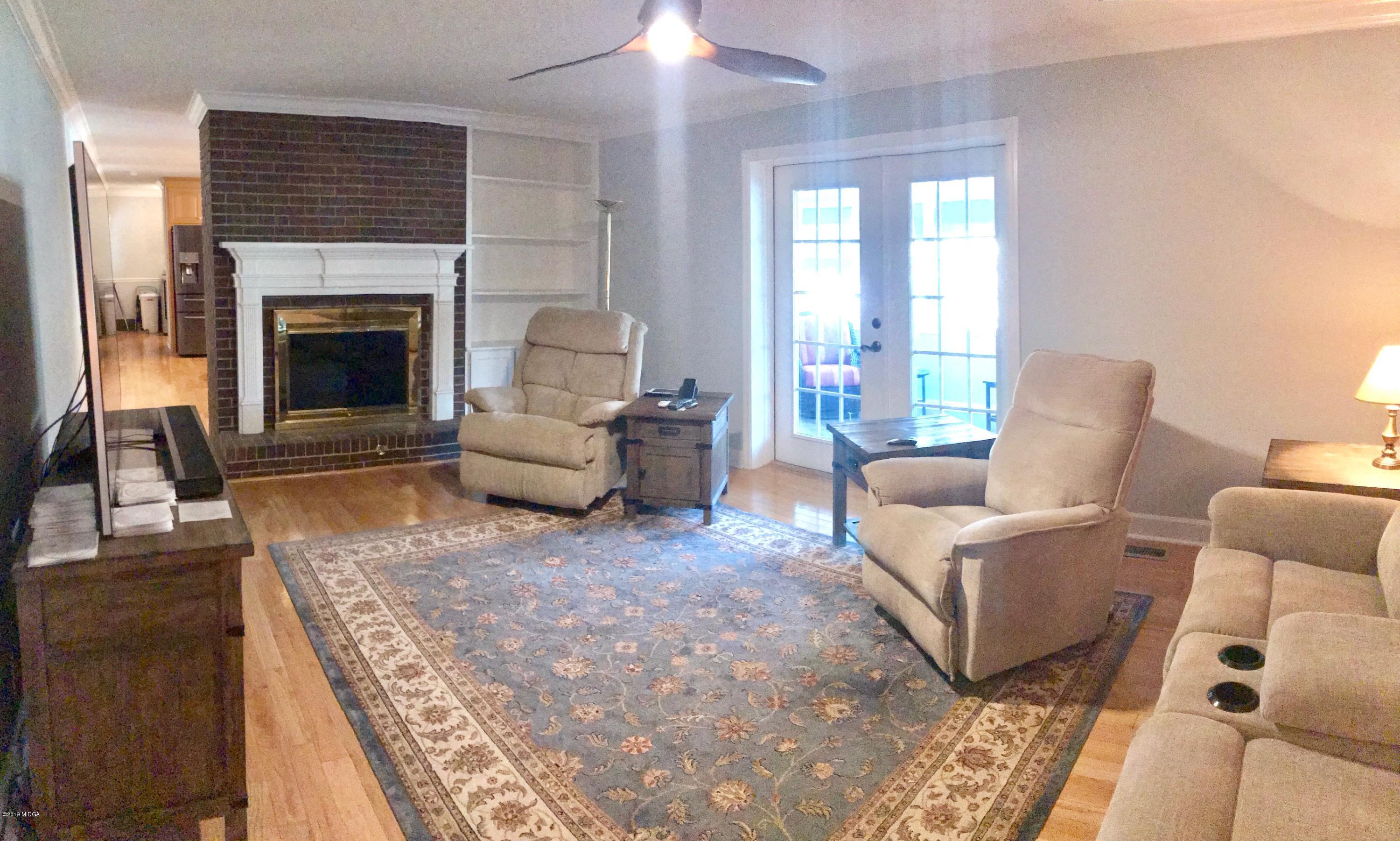 5838 School Road Macon, GA 31216 - Photo 9 of 33 a living room with furniture and a fireplace
