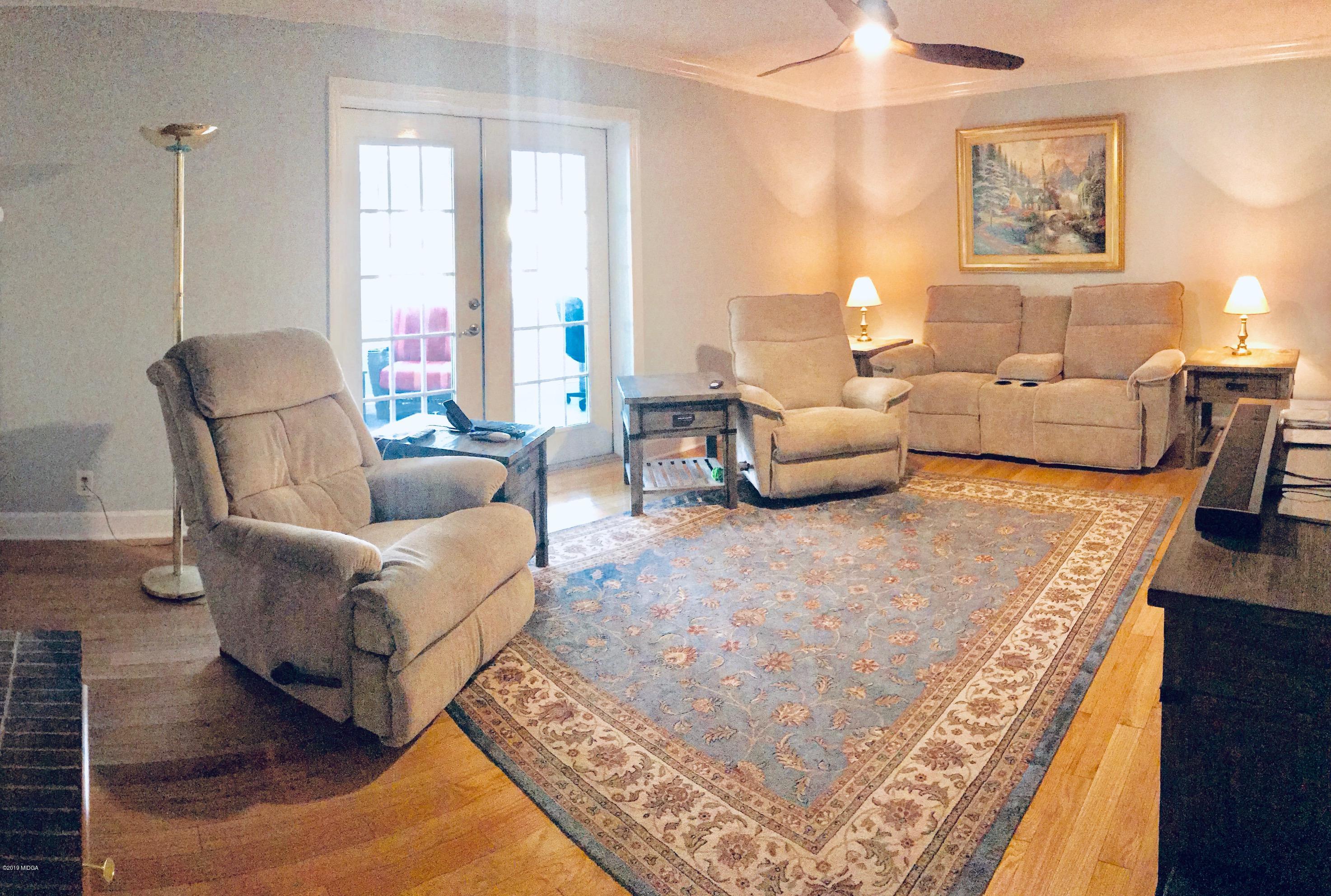 5838 School Road Macon, GA 31216 - Photo 10 of 33 a living room with furniture and a rug