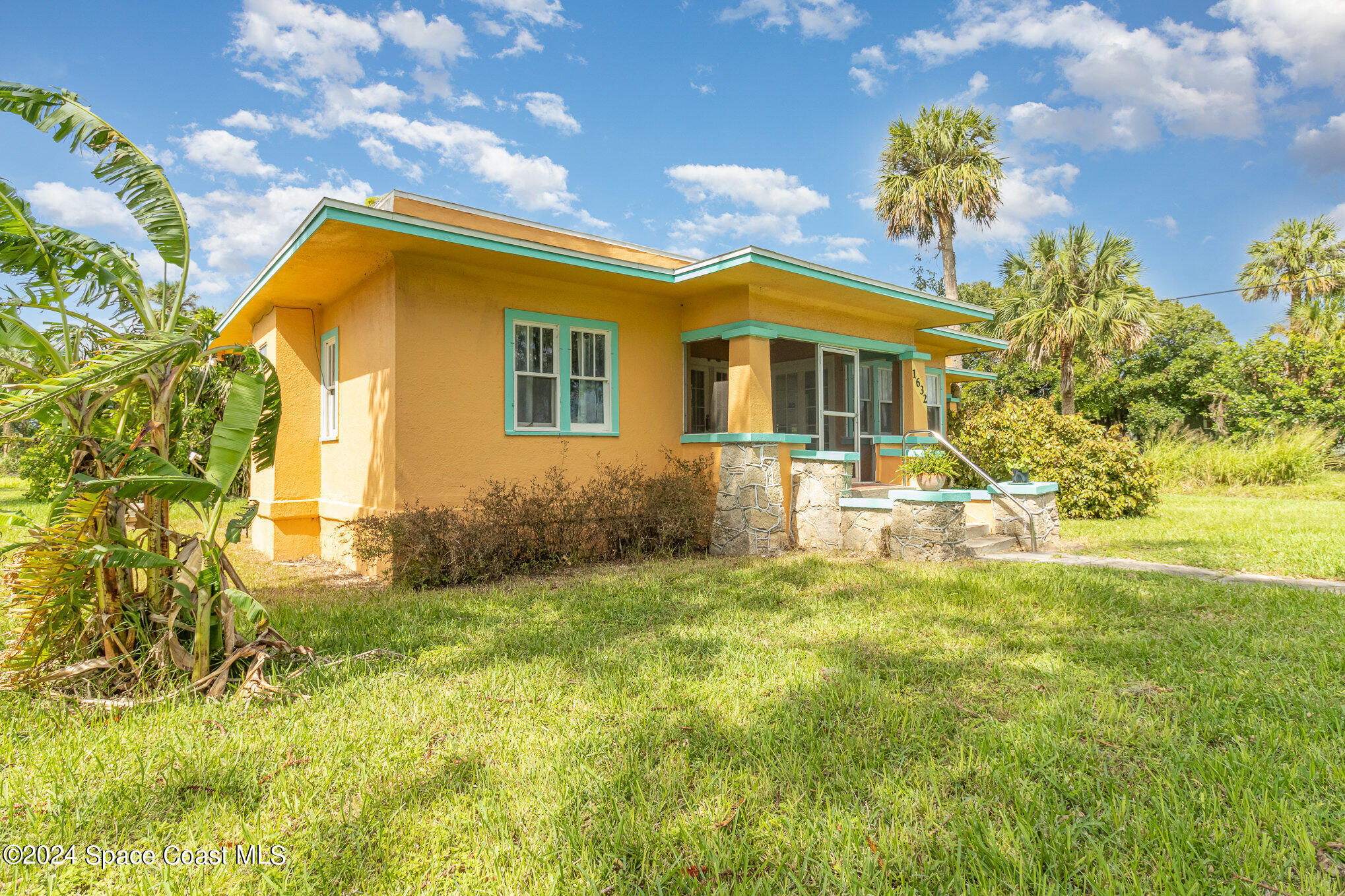 1632 Water Drive Northeast Palm Bay, FL 32905 - Photo 11 of 31 a front view of house with yard