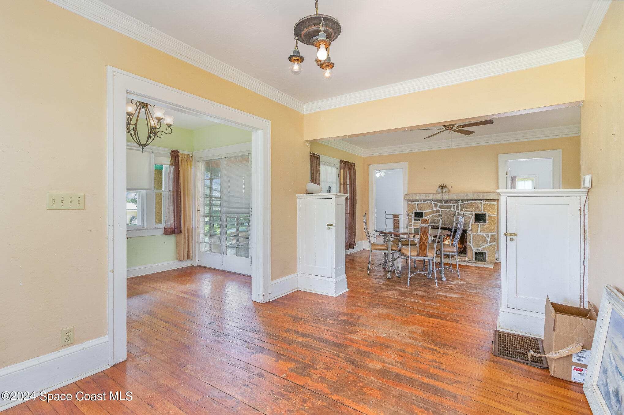 1632 Water Drive Northeast Palm Bay, FL 32905 - Photo 18 of 31 a view of a livingroom with furniture wooden floor and a ceiling fan
