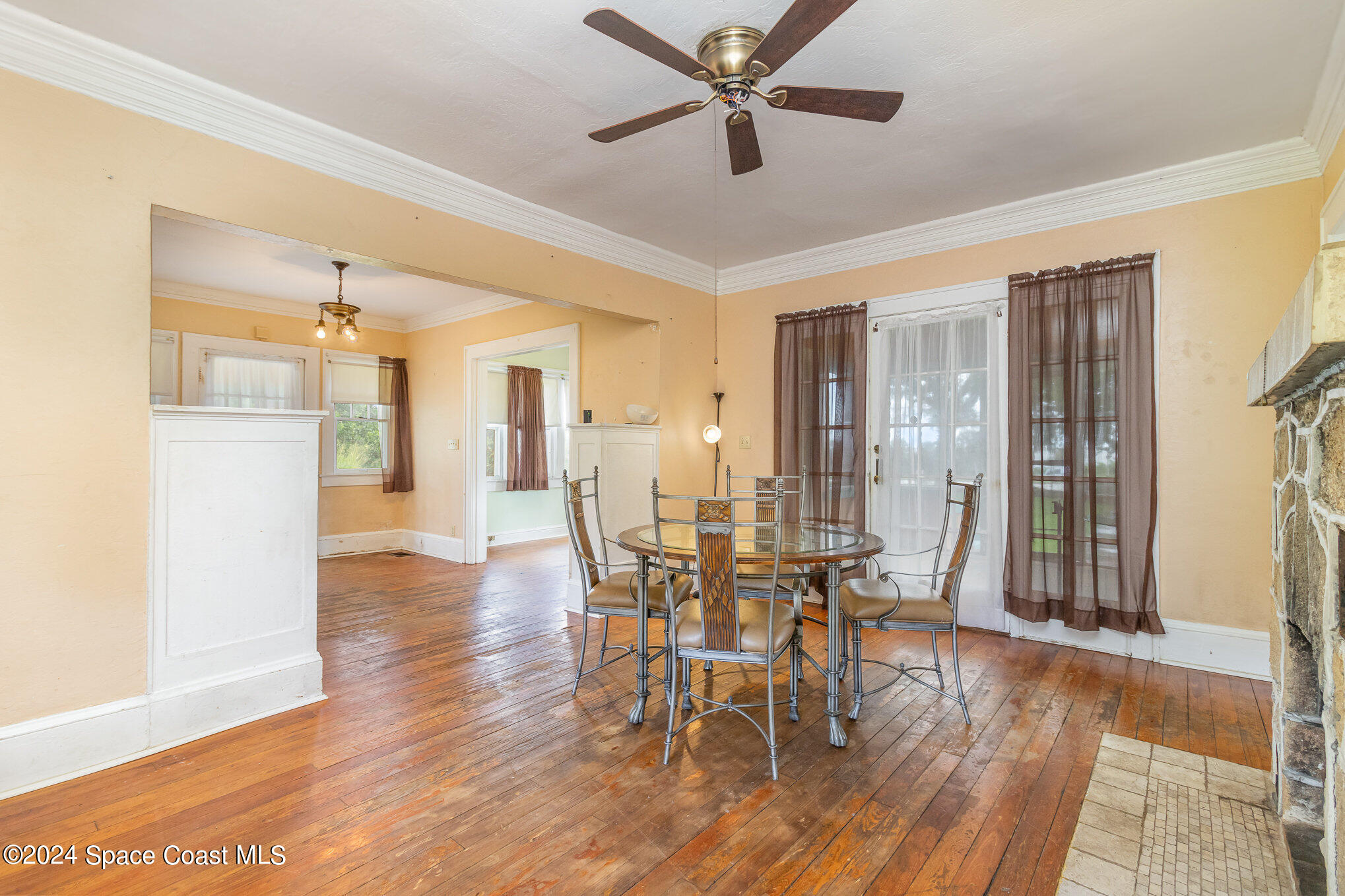1632 Water Drive Northeast Palm Bay, FL 32905 - Photo 20 of 31 a view of a a dining room with furniture window and wooden floor