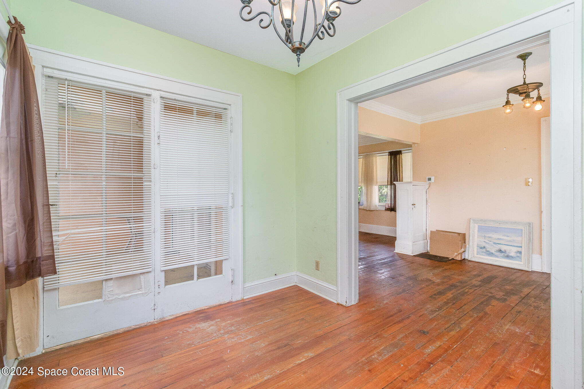1632 Water Drive Northeast Palm Bay, FL 32905 - Photo 22 of 31 a view of a hallway with wooden floor and a cabinet