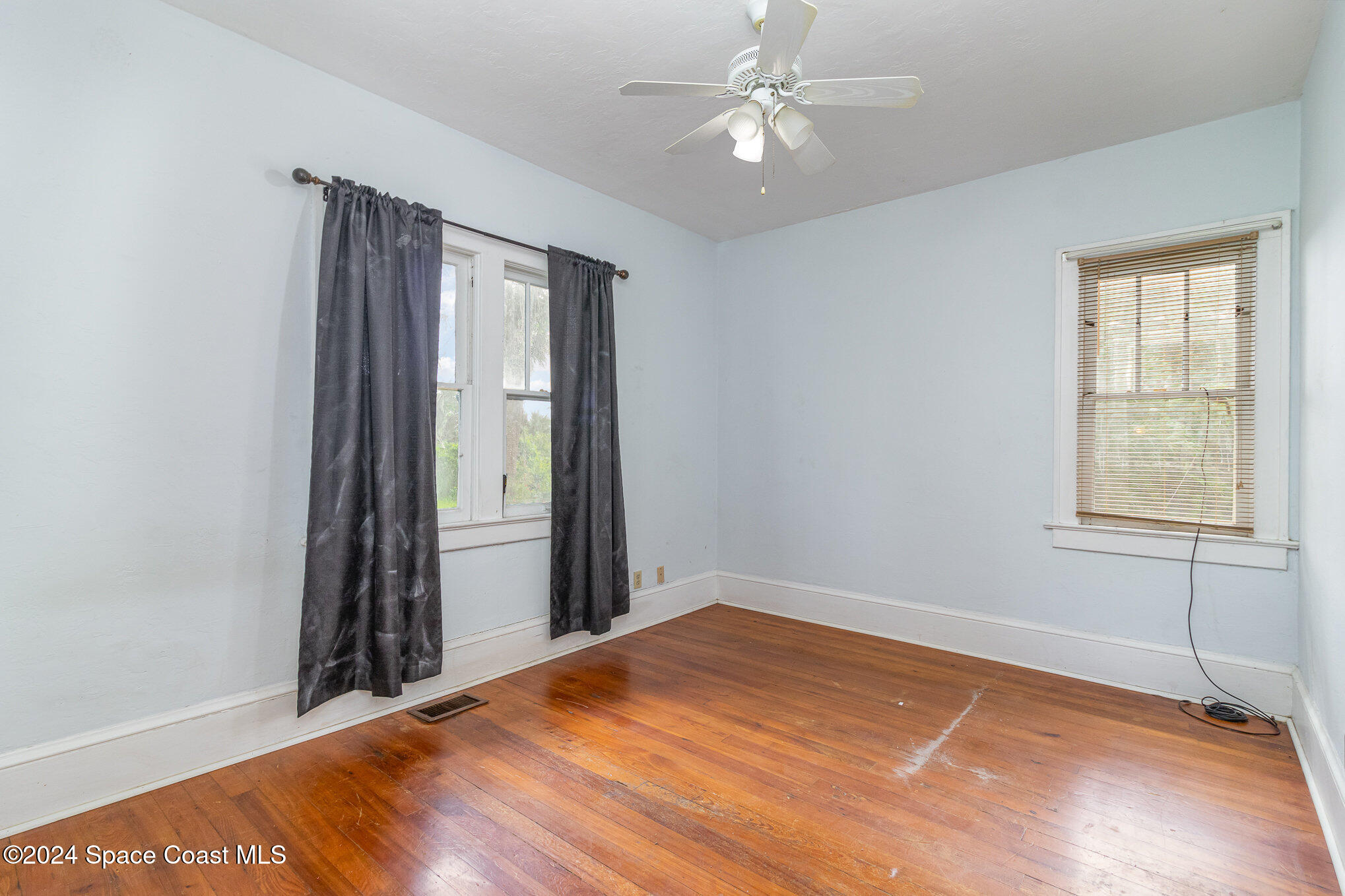 1632 Water Drive Northeast Palm Bay, FL 32905 - Photo 26 of 31 a view of a room with a ceiling fan and window