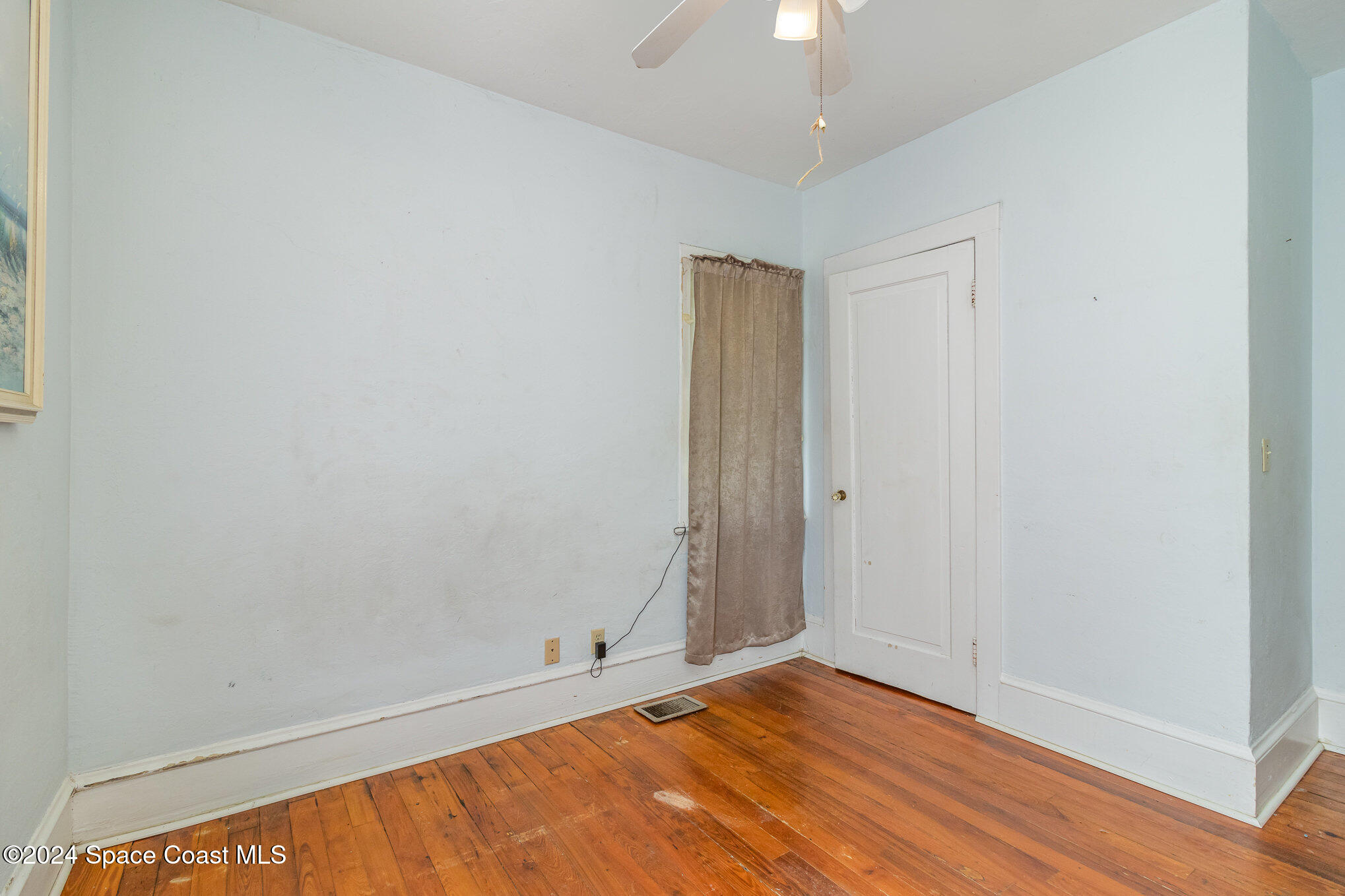 1632 Water Drive Northeast Palm Bay, FL 32905 - Photo 30 of 31 a view of room with window and hardwood floor