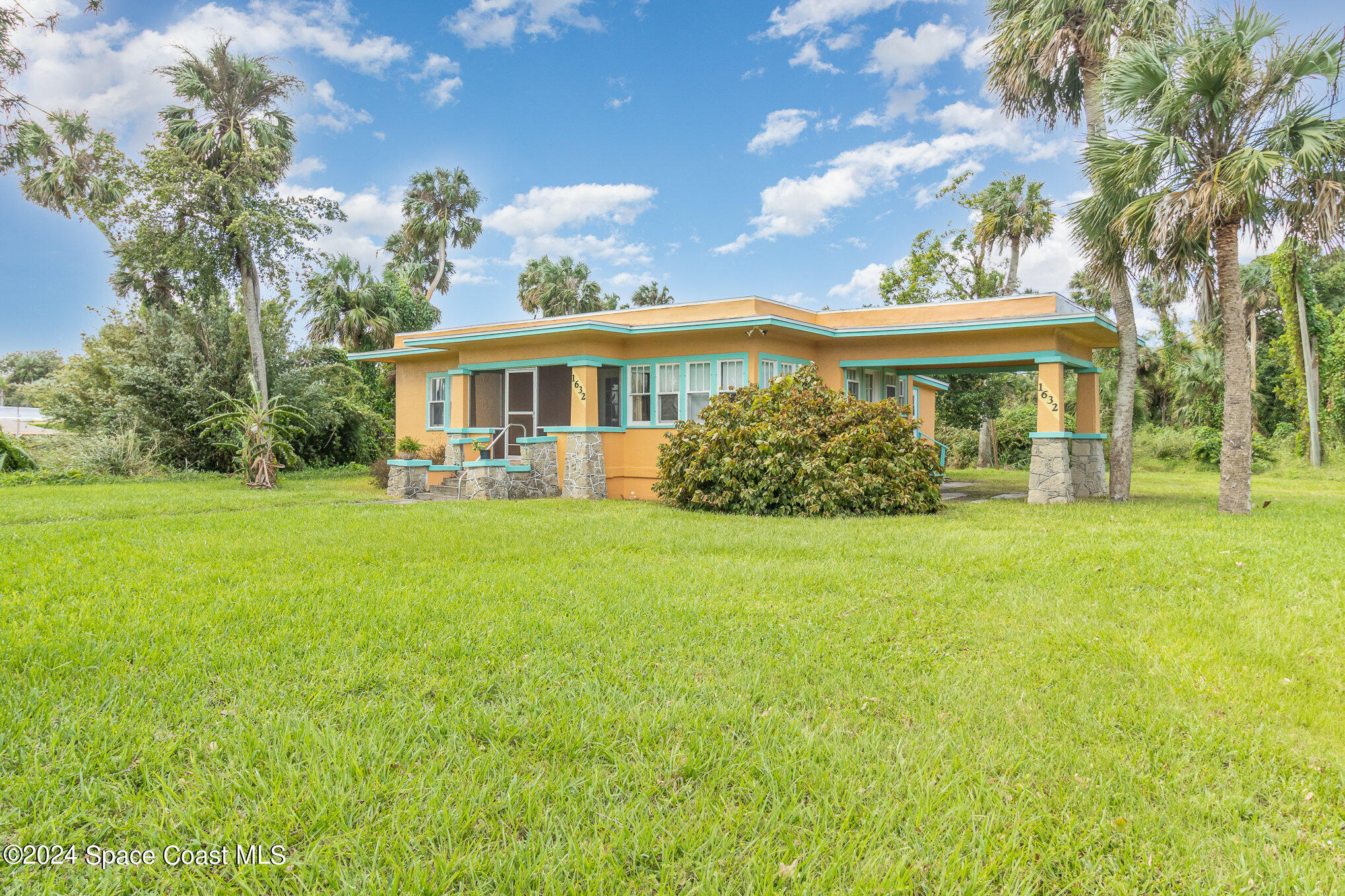 1632 Water Drive Northeast Palm Bay, FL 32905 - Photo 5 of 31 a front view of house with yard and green space