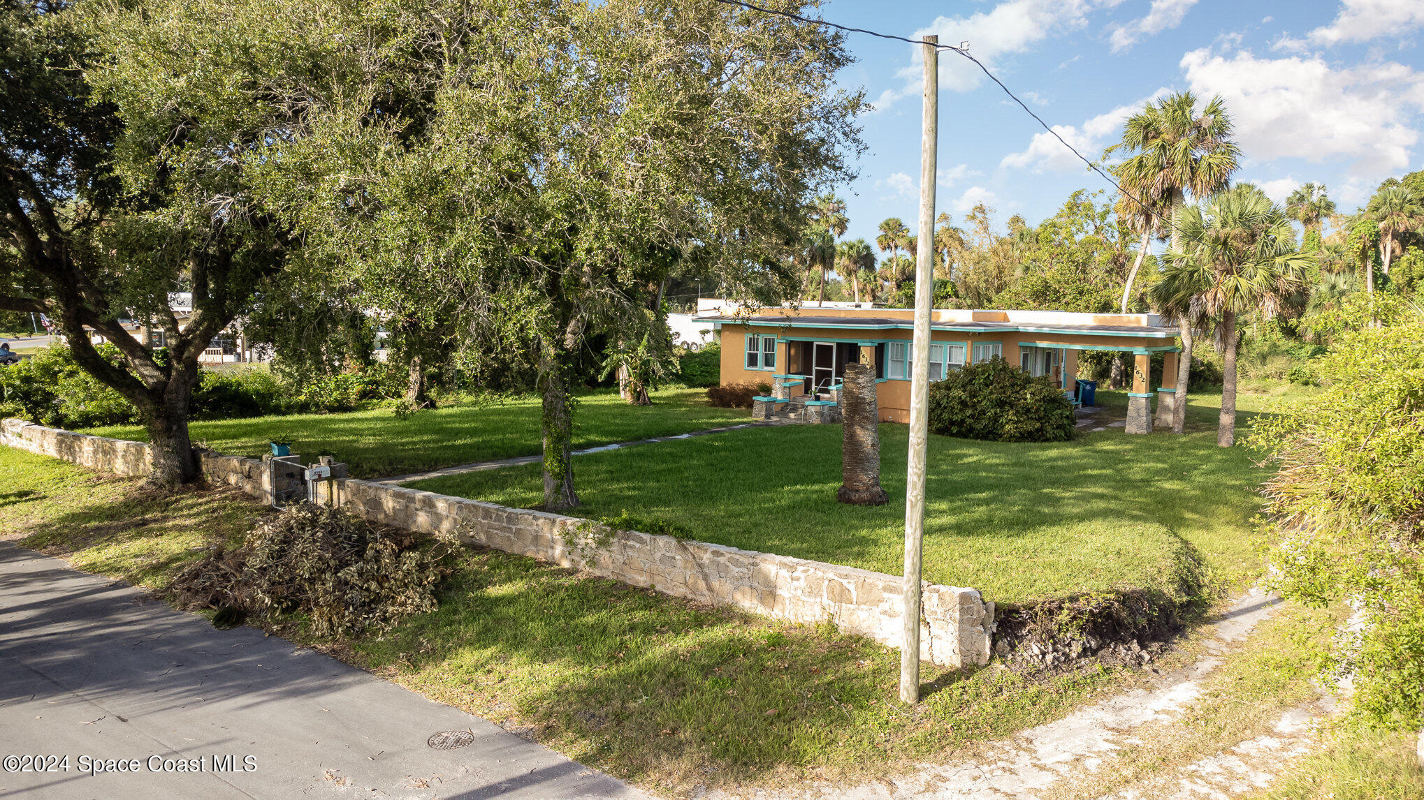 1632 Water Drive Northeast Palm Bay, FL 32905 - Photo 8 of 31 a view of a house with a yard