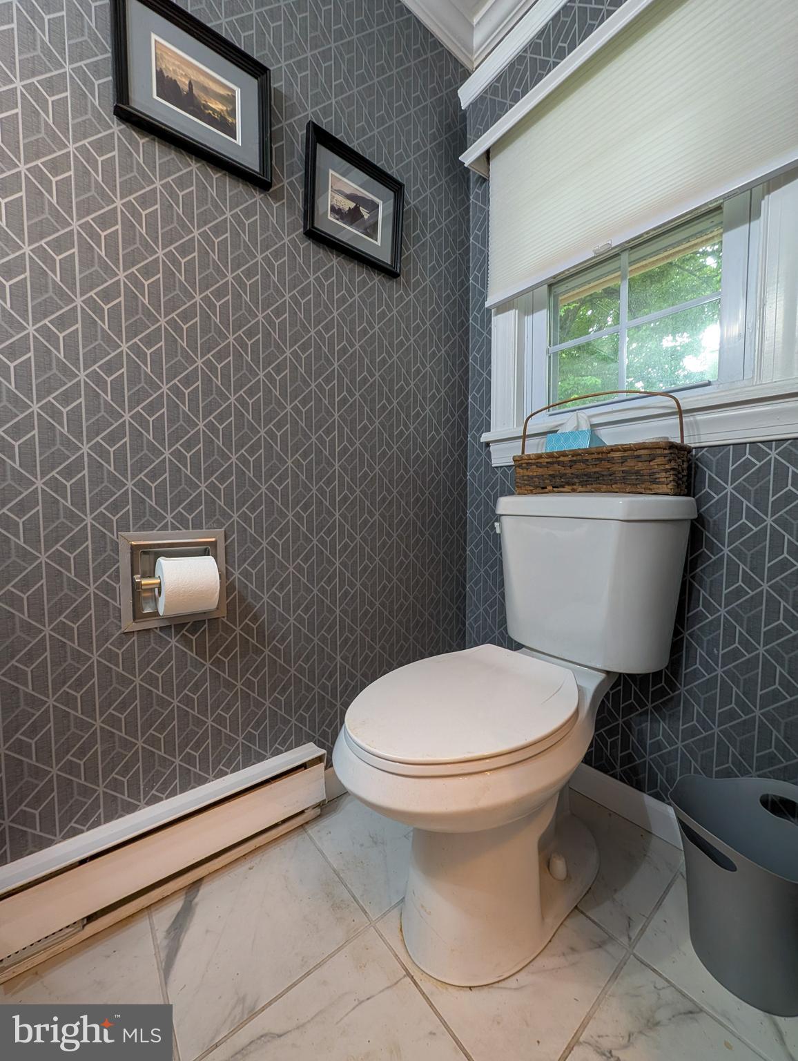 2941 Pheasant Run Road Norristown, PA 19403 - Photo 15 of 23 a white toilet sitting next to a bathroom sink