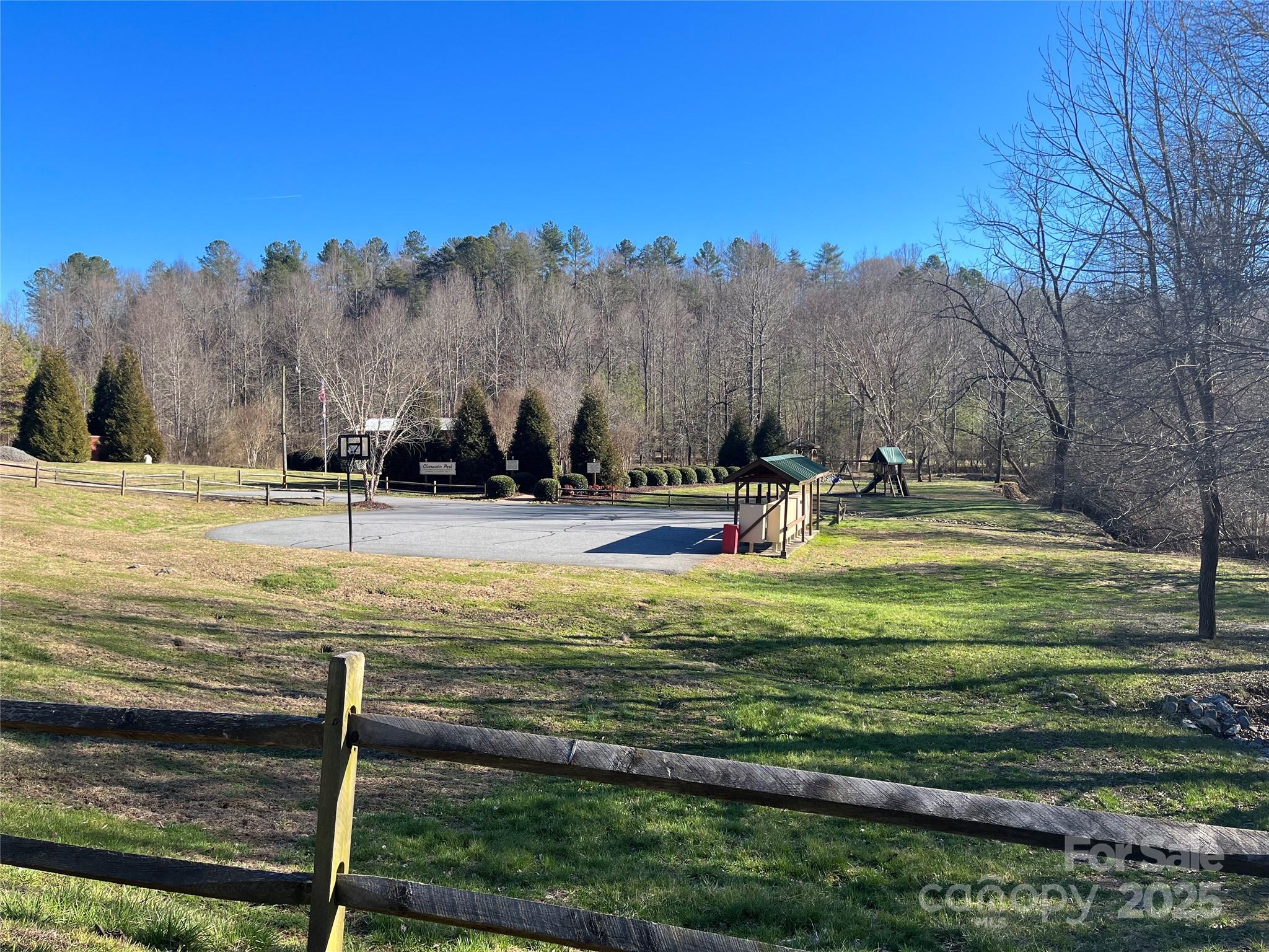 0 Creekside Circle, Unit 126 Rutherfordton, NC 28139 - Photo 13 of 16 a backyard of a house with table and chairs