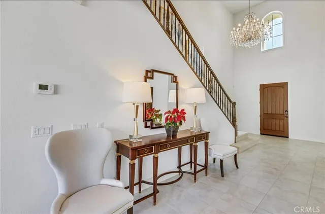 a workspace with furniture and a chandelier