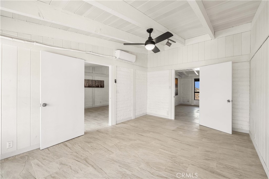 6308 Hawarden Drive Riverside, CA 92506 - Photo 14 of 37 a view of a big room with wooden floor and ceiling fan