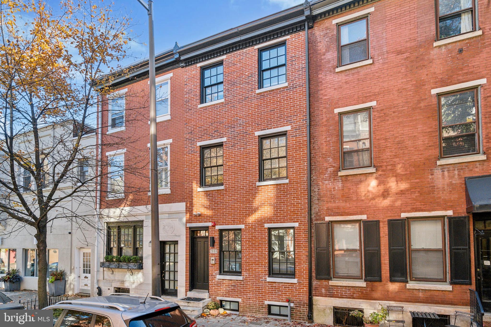 2006 Pine Street, Unit 2 Philadelphia, PA 19103 - Photo 2 of 12 a front view of a building with a yard