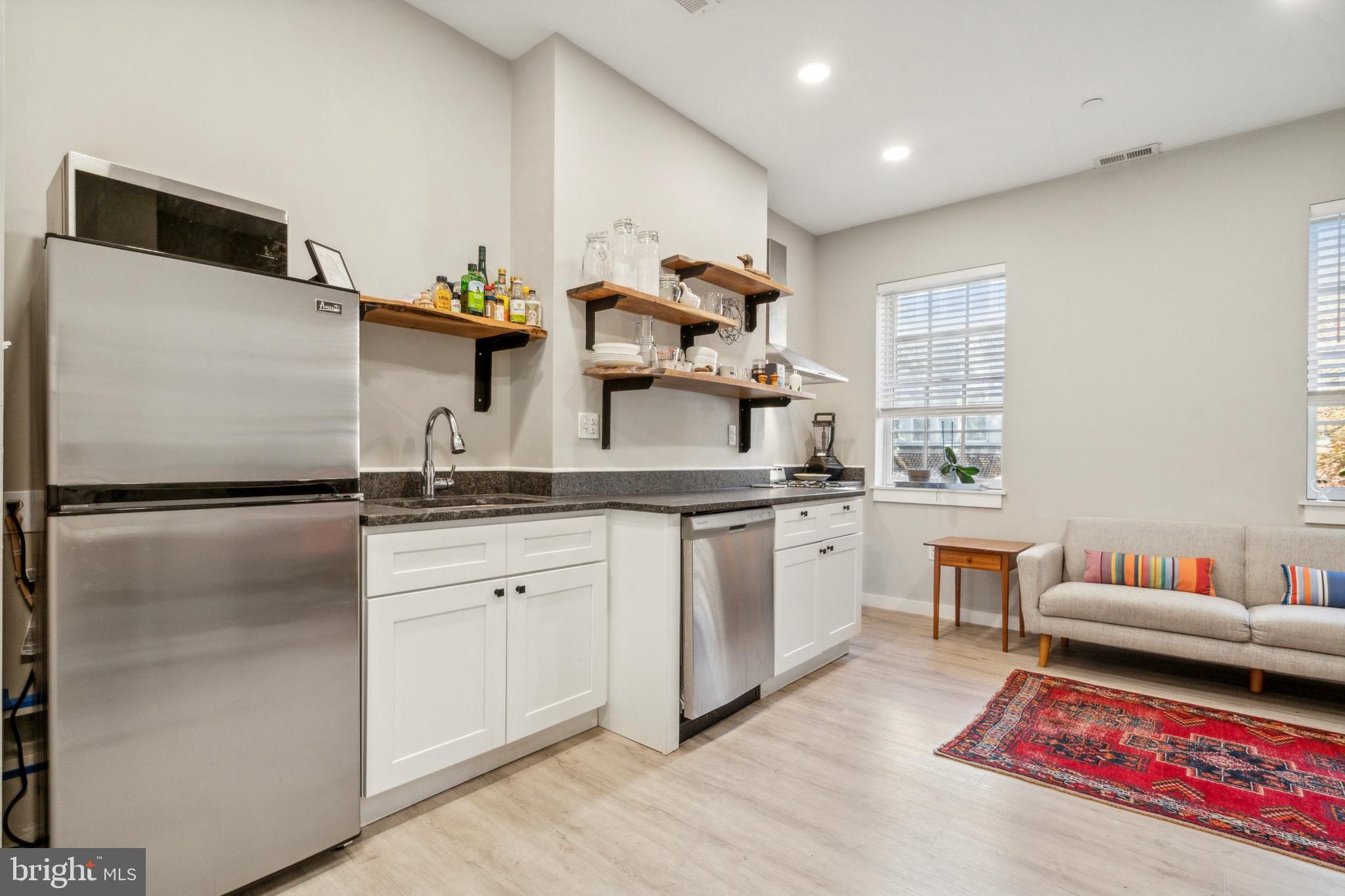 2006 Pine Street, Unit 2 Philadelphia, PA 19103 - Photo 5 of 12 a kitchen with a refrigerator and a sink
