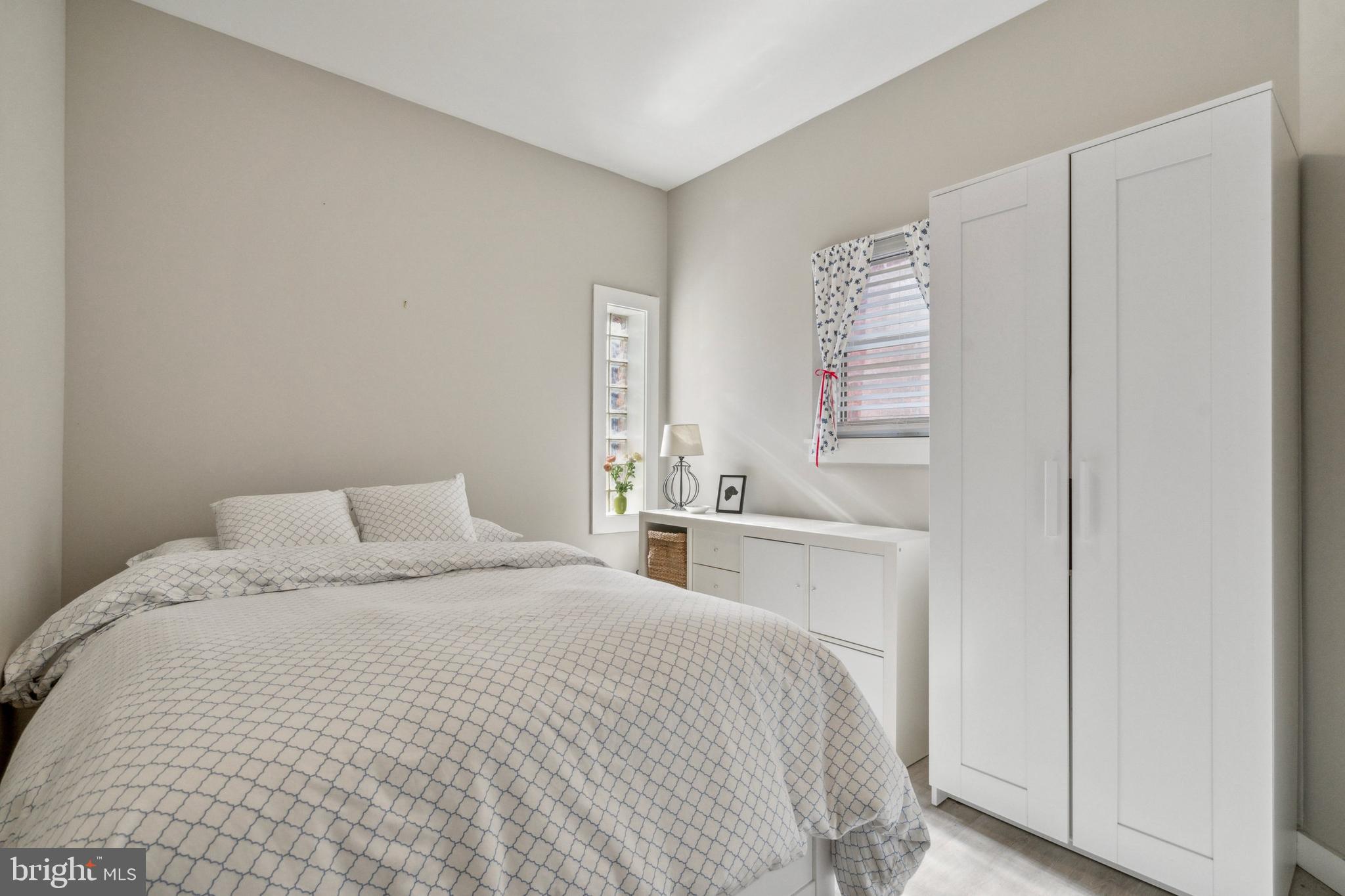 2006 Pine Street, Unit 2 Philadelphia, PA 19103 - Photo 8 of 12 a bedroom with a bed and a window