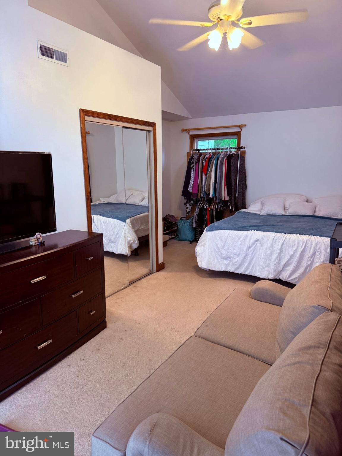 18318 Sharon Road Triangle, VA 22172 - Photo 11 of 27 a bedroom with a bed and a flat tv screen on dresser