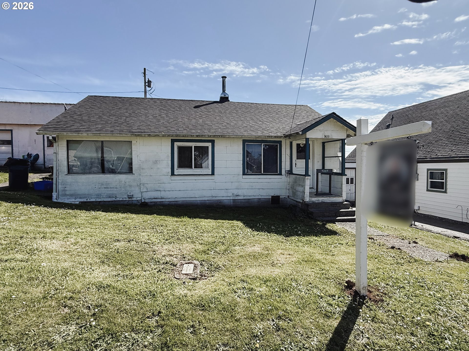 827 East 11th Street Coquille, OR 97423 - Photo 1 of 45 a front view of a house with a yard