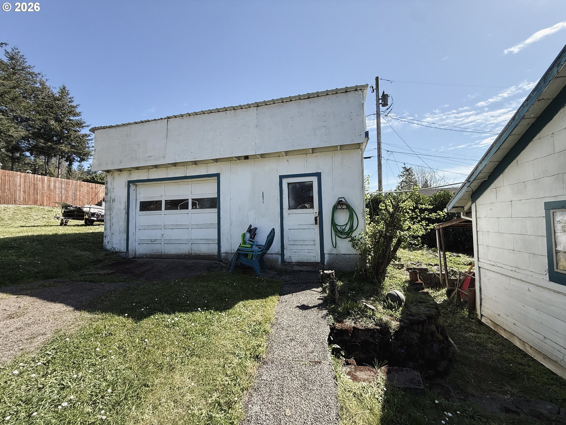 827 East 11th Street Coquille, OR 97423 - Photo 12 of 45 a backyard of a house with yard fire pit and outdoor seating