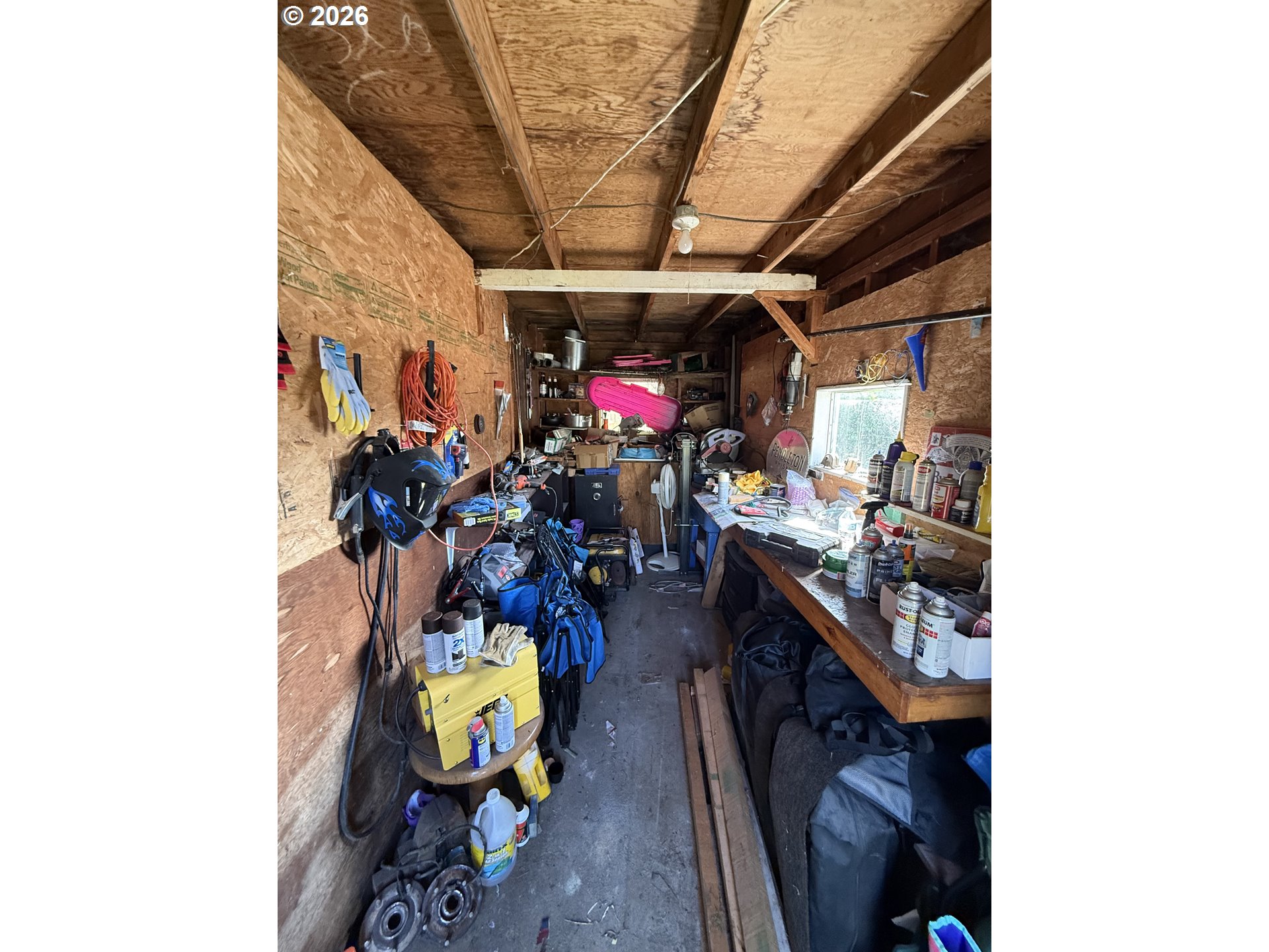 827 East 11th Street Coquille, OR 97423 - Photo 15 of 45 a view of a hallway with couch and a potted plant
