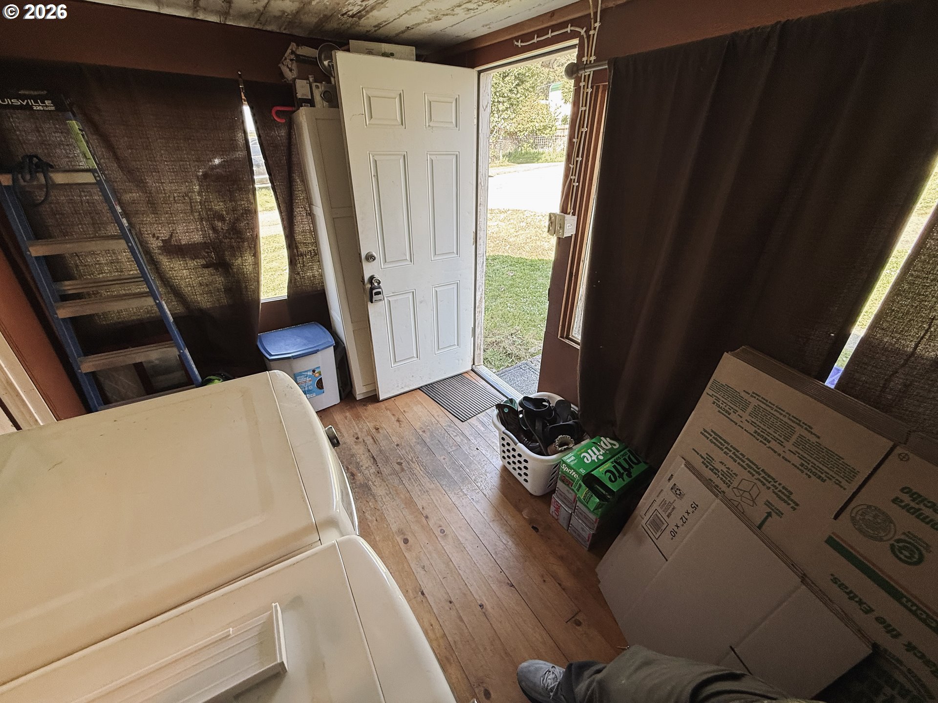 827 East 11th Street Coquille, OR 97423 - Photo 19 of 45 a living room with furniture and a fireplace