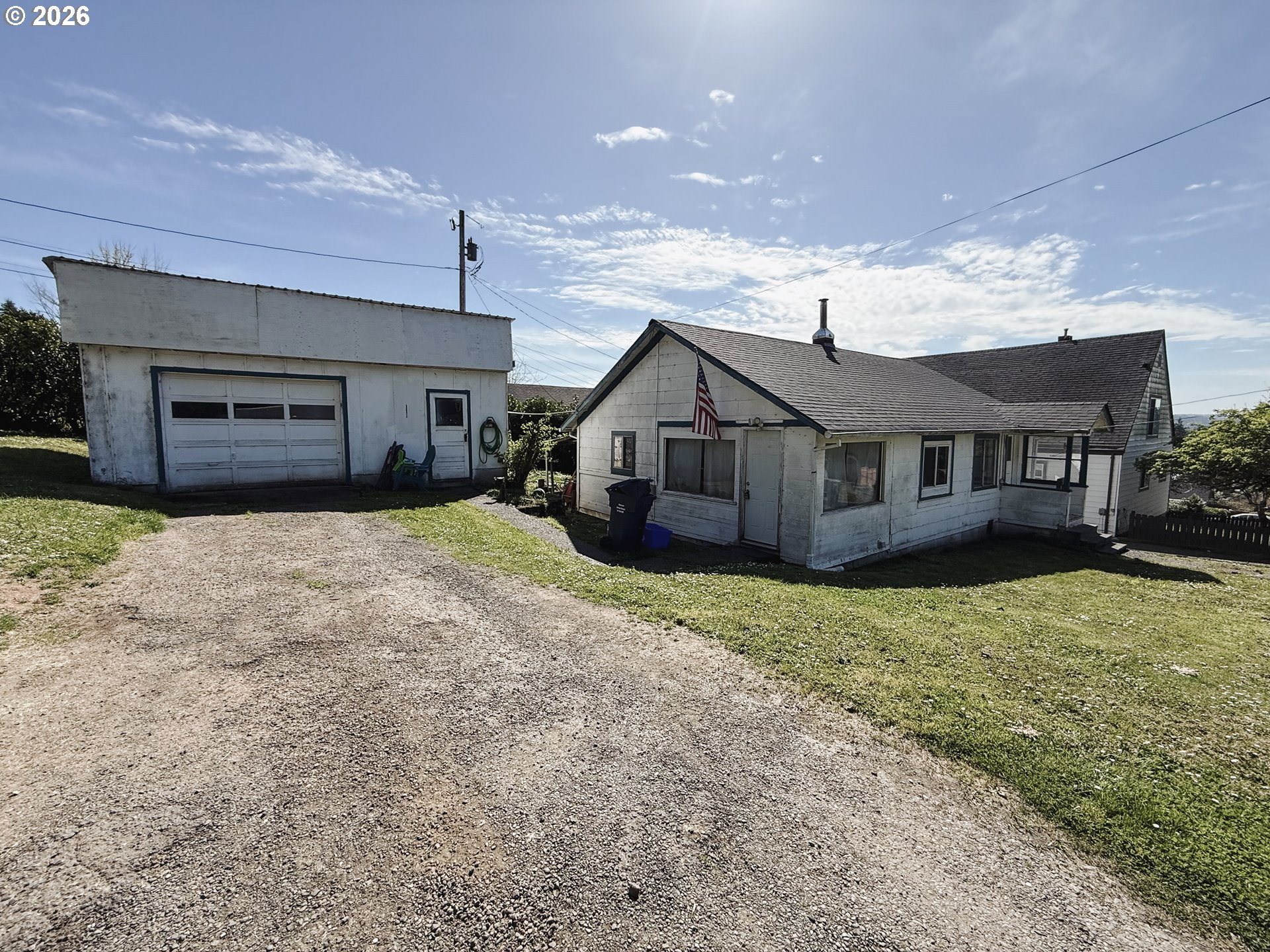 827 East 11th Street Coquille, OR 97423 - Photo 2 of 45 a view of a house with a yard and large tree