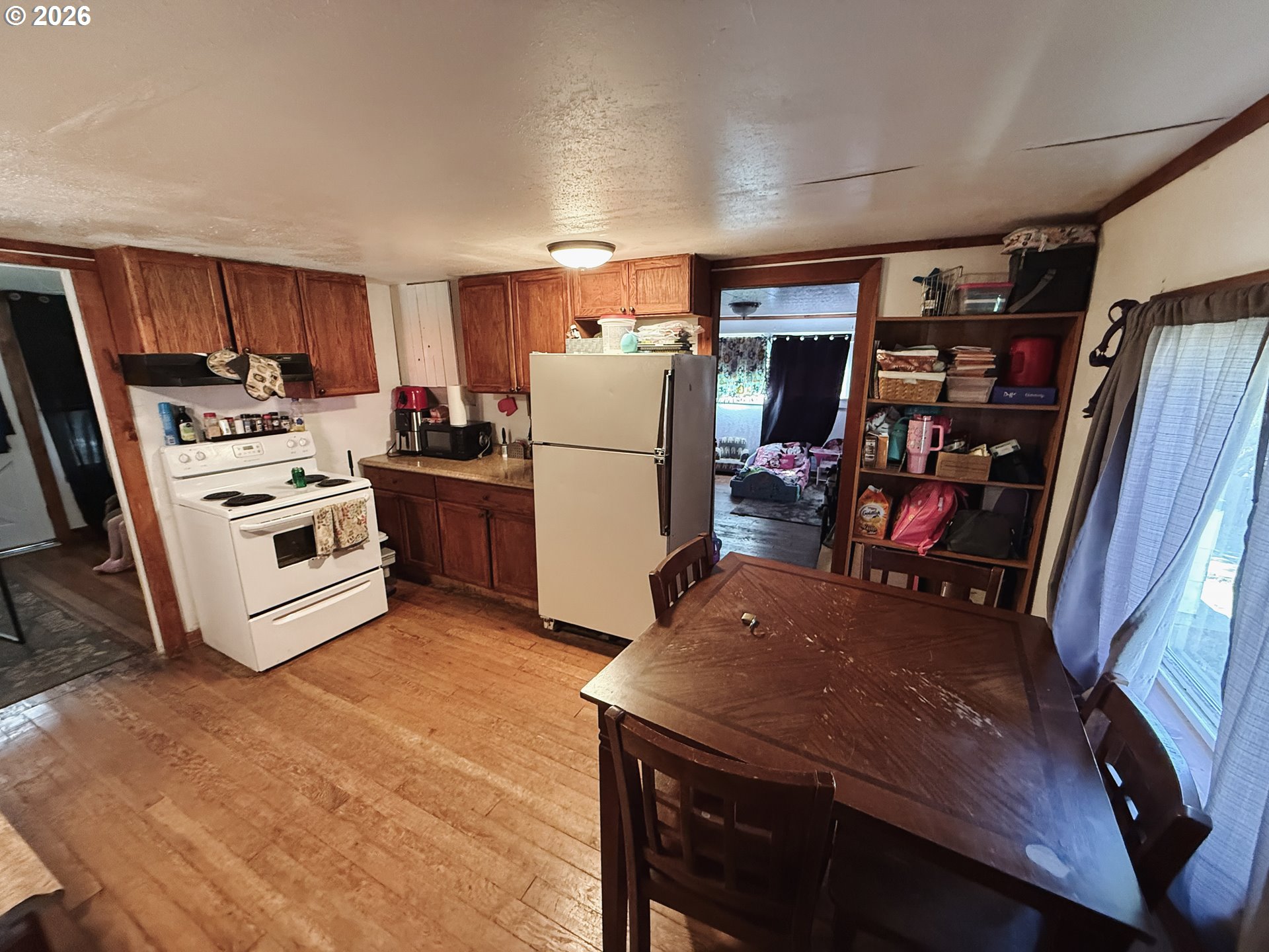 827 East 11th Street Coquille, OR 97423 - Photo 23 of 45 a kitchen with stainless steel appliances a stove a refrigerator and a refrigerator