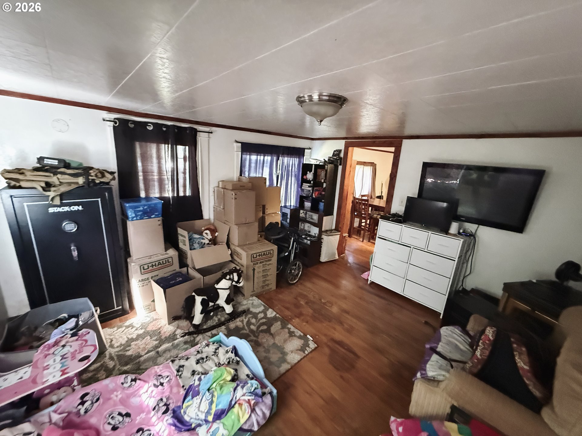 827 East 11th Street Coquille, OR 97423 - Photo 28 of 45 a living room with furniture and a flat screen tv