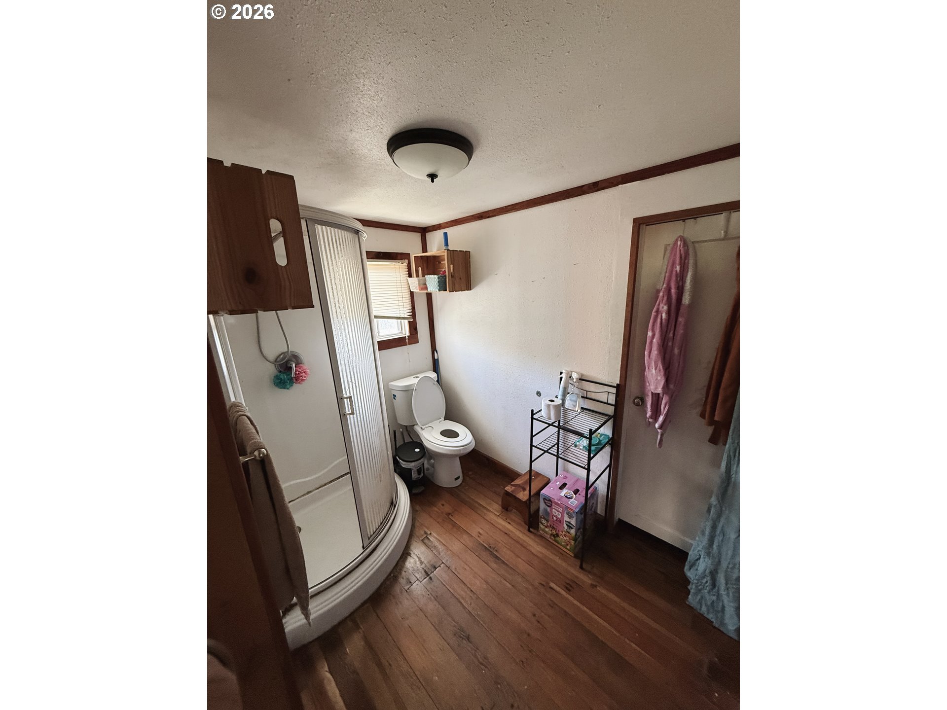 827 East 11th Street Coquille, OR 97423 - Photo 36 of 45 a view of a livingroom with furniture and a hallway