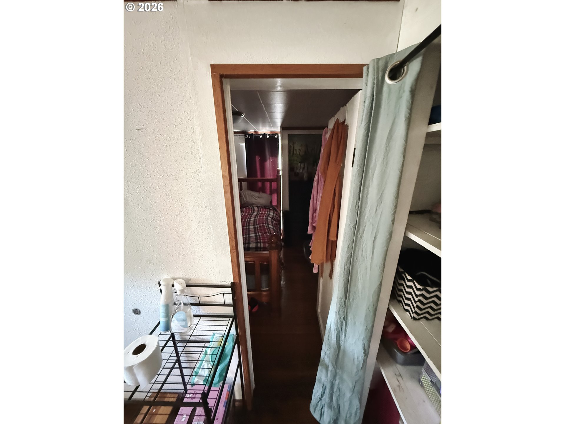 827 East 11th Street Coquille, OR 97423 - Photo 39 of 45 a view of walk in closet with clothes and shoes