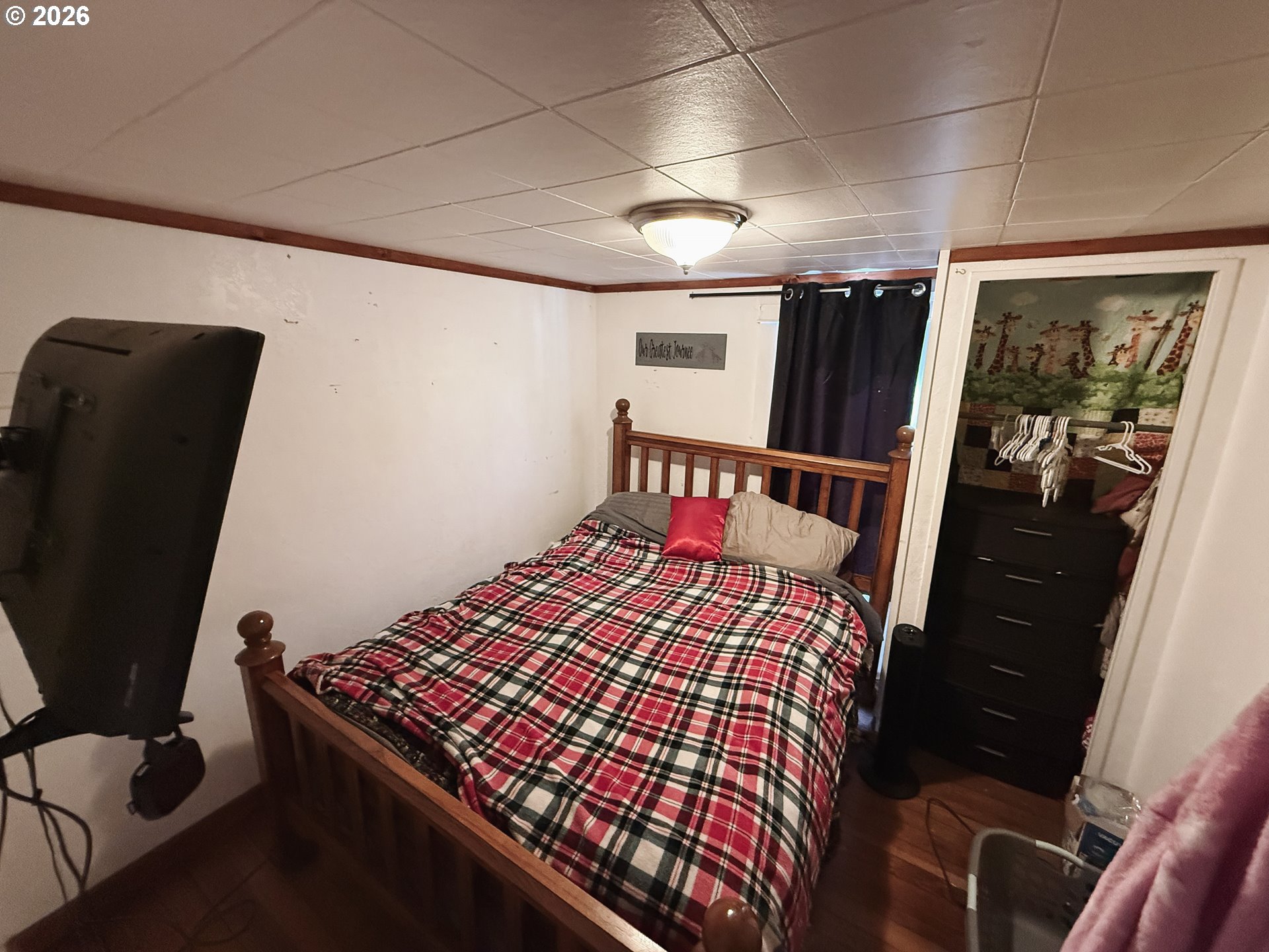 827 East 11th Street Coquille, OR 97423 - Photo 40 of 45 a bedroom with furniture and a window