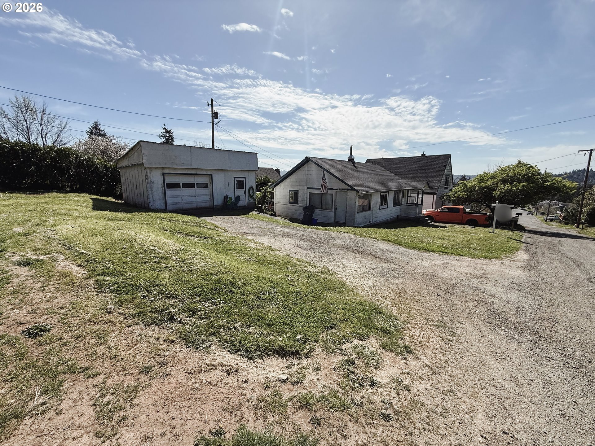 827 East 11th Street Coquille, OR 97423 - Photo 8 of 45 a view of a house with a yard and large tree