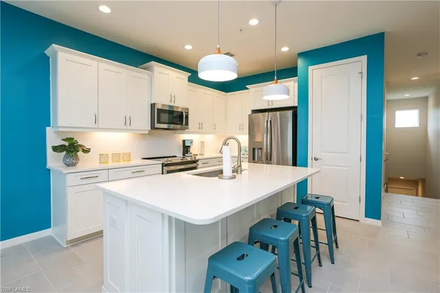 a kitchen with a table and chairs in it