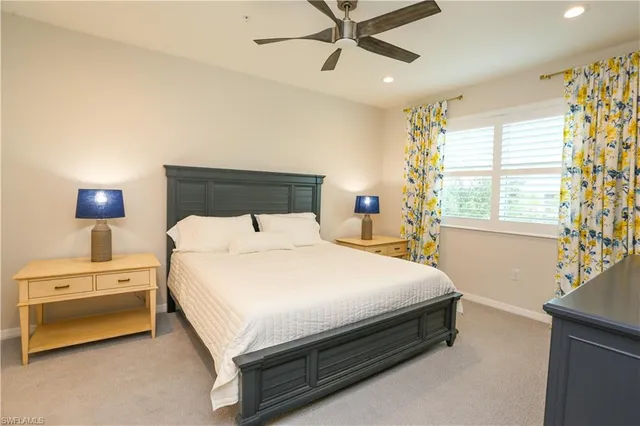 a bed room with a bed and a chandelier