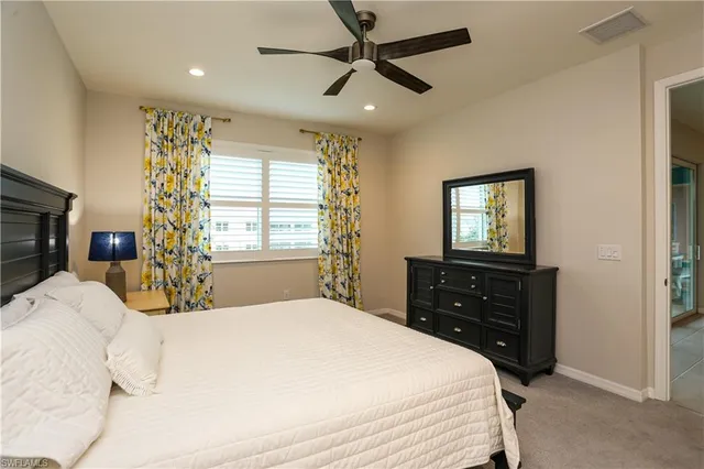 a bedroom with a bed and a tv