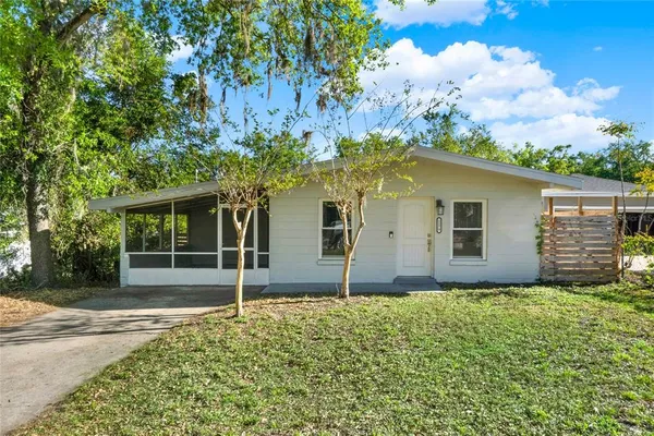 a house with trees in the background