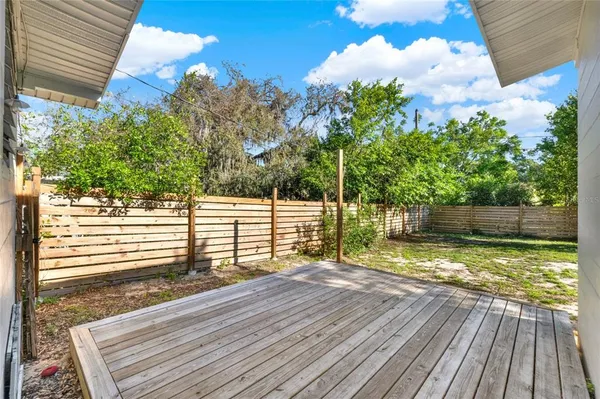 a view of a balcony with wooden floor