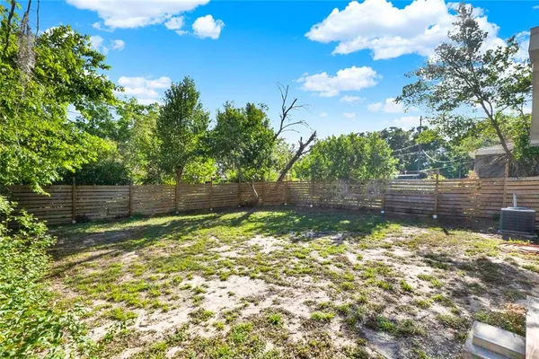 a backyard of a house with lots of green space