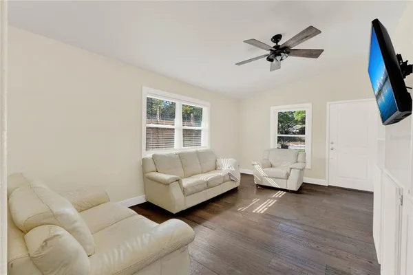 a living room with furniture and a window