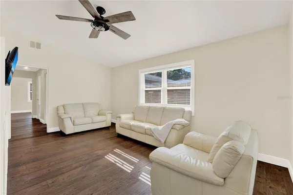 a living room with furniture and a window