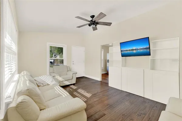 a living room with furniture and a window