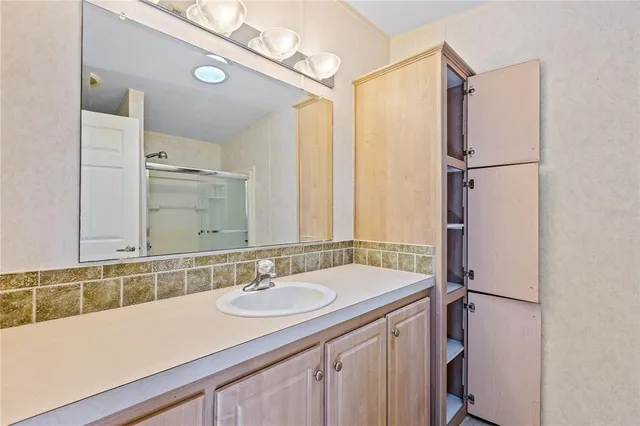 a kitchen with stainless steel appliances cabinets and a refrigerator