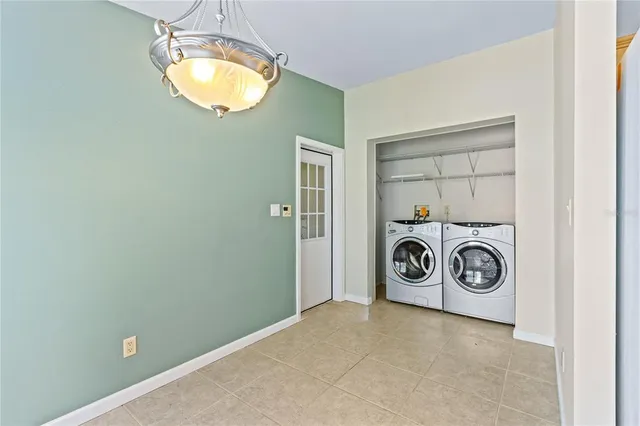 an aerial view of a house with a lake view