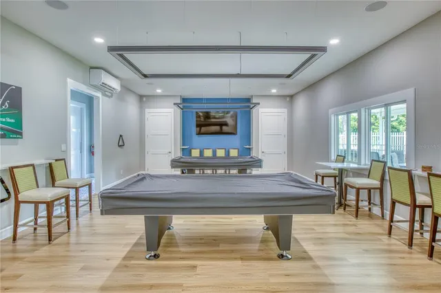 an aerial view of a house with a swimming pool