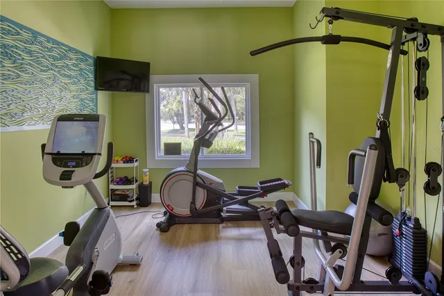 an aerial view of a house with a yard and lake view