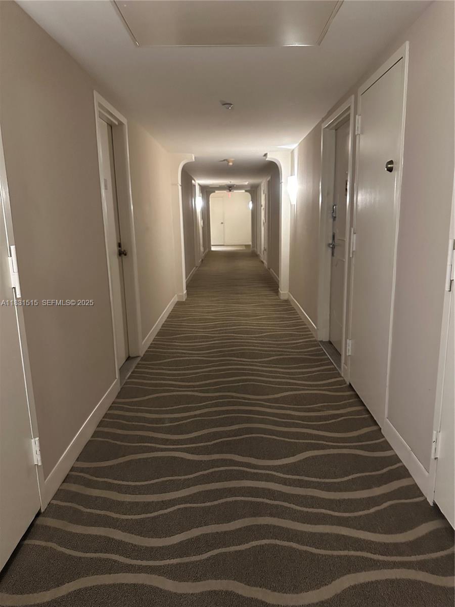 2333 Brickell Avenue, Unit 901 Miami, FL 33129 - Photo 19 of 79 a view of a hallway with wooden floor and closet