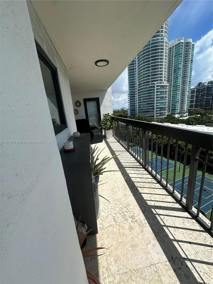 2333 Brickell Avenue, Unit 901 Miami, FL 33129 - Photo 33 of 79 a view of balcony with wooden floor and fence