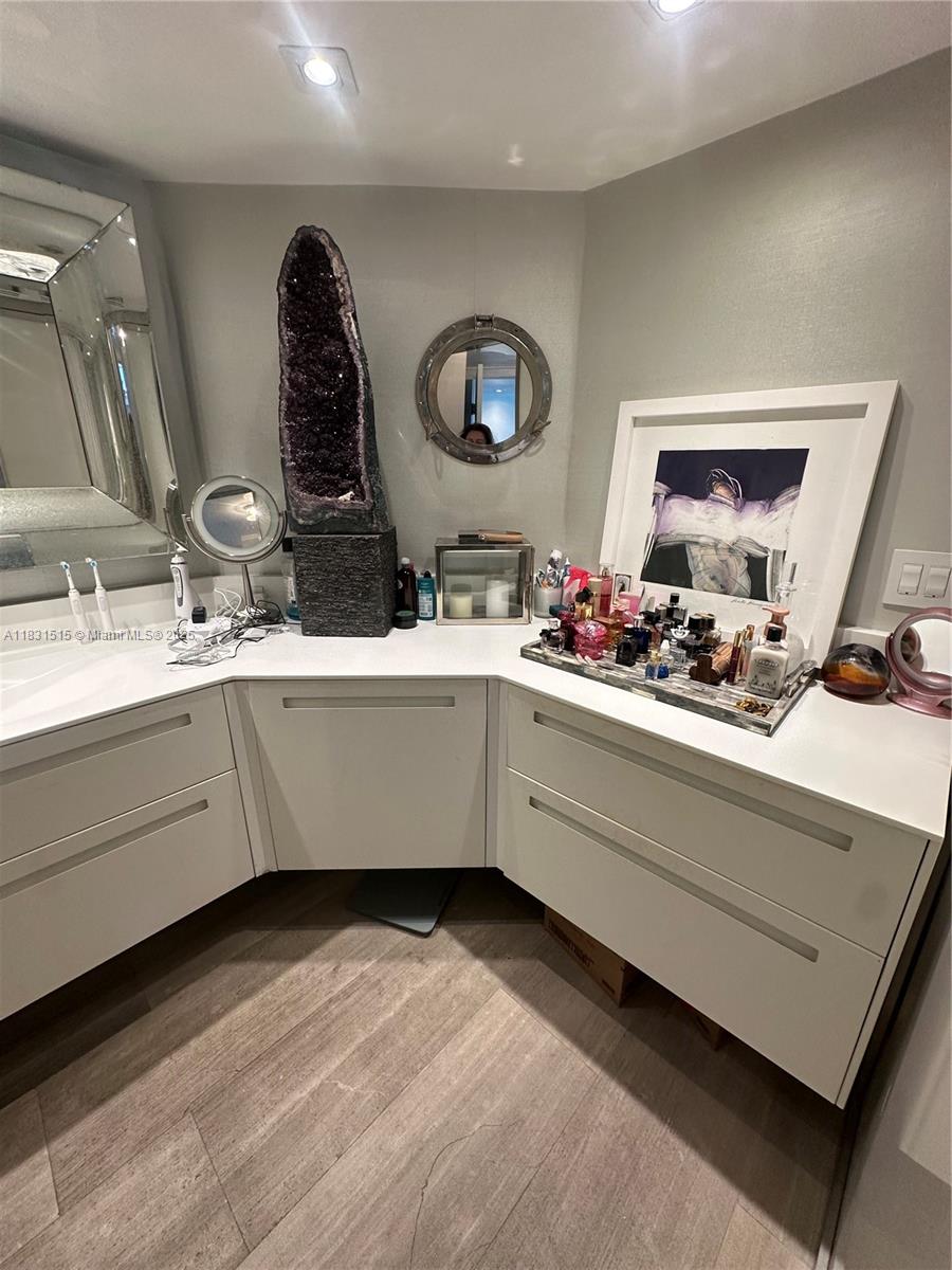 2333 Brickell Avenue, Unit 901 Miami, FL 33129 - Photo 42 of 79 a bathroom with a double vanity sink and a mirror