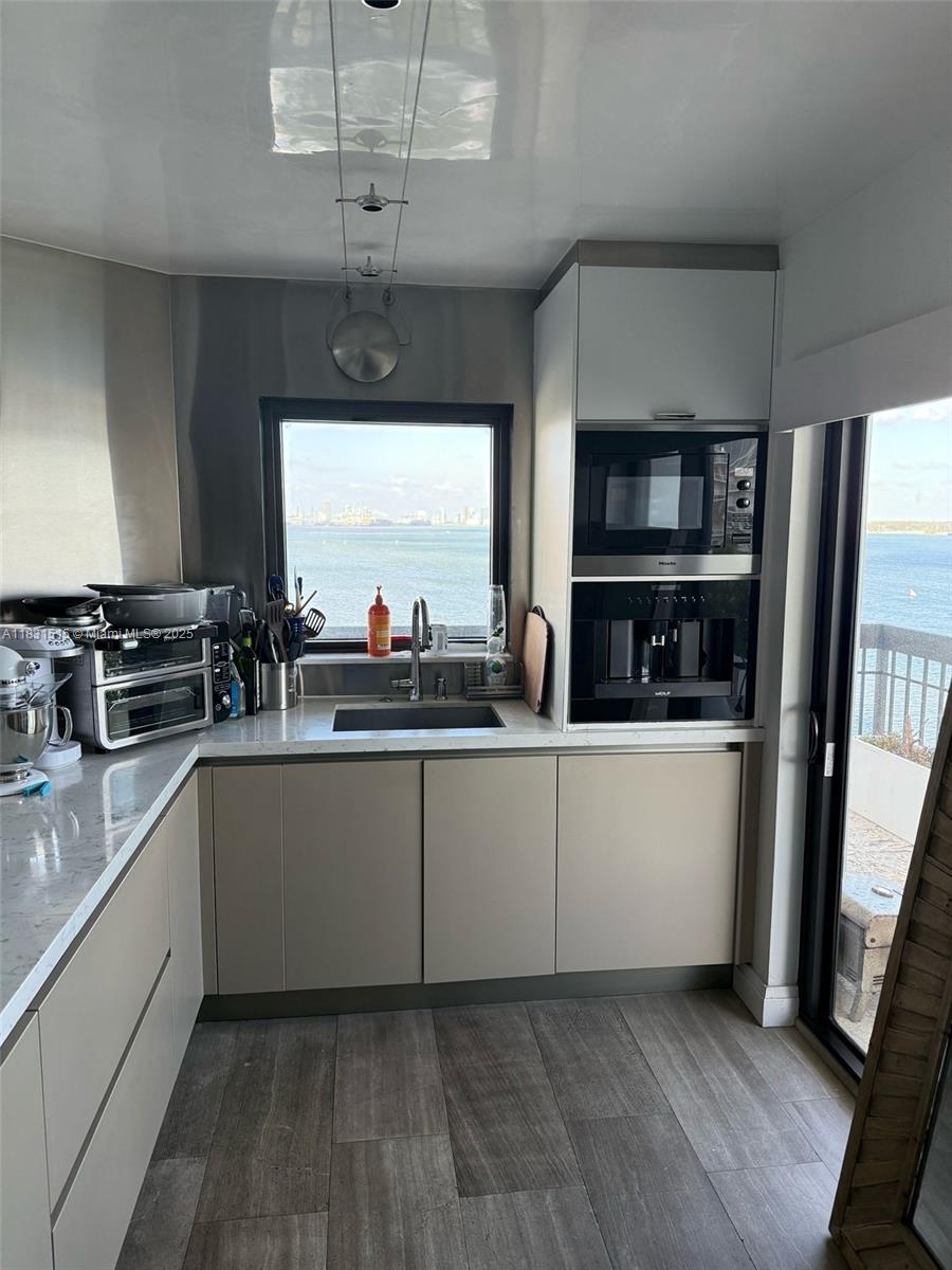 2333 Brickell Avenue, Unit 901 Miami, FL 33129 - Photo 60 of 79 a kitchen with stainless steel appliances a refrigerator and a sink