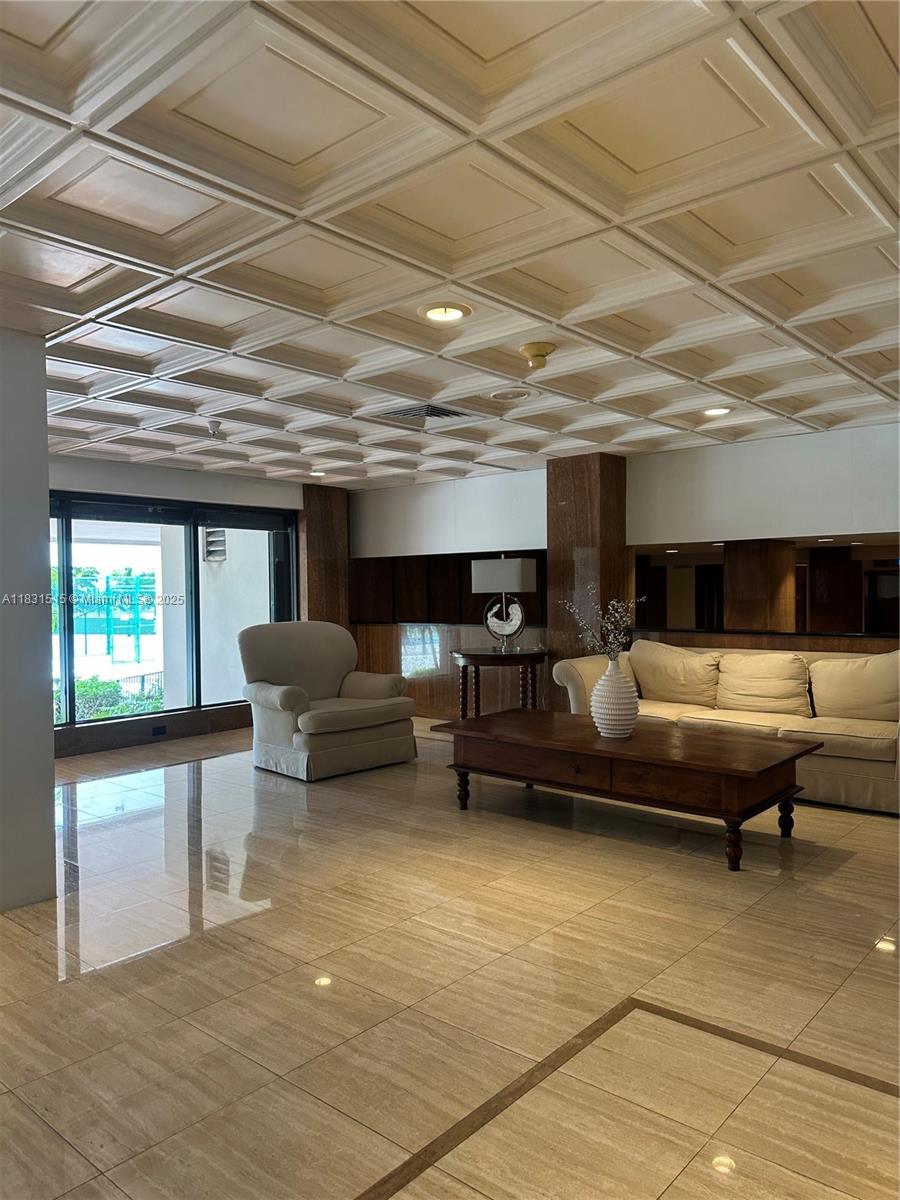 2333 Brickell Avenue, Unit 901 Miami, FL 33129 - Photo 7 of 79 a living room with furniture and a flat screen tv